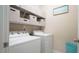 Laundry room featuring side-by-side washer and dryer with overhead shelving at 65 Wood Green Dr, Wendell, NC 27591