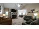 Open-concept living room featuring a fireplace, built-ins, and wood-look flooring at 65 Wood Green Dr, Wendell, NC 27591