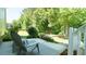 Outdoor patio features lounge chairs, a decorative rug, and access to the well-manicured backyard at 65 Wood Green Dr, Wendell, NC 27591