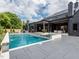 Luxury backyard featuring a pool, spa, and a beautifully designed modern home at 661 Manchester Dr, Raleigh, NC 27609