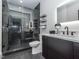 Modern bathroom featuring black hardware and glass enclosed shower at 661 Manchester Dr, Raleigh, NC 27609