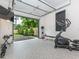 Garage converted to home gym with open door to backyard at 661 Manchester Dr, Raleigh, NC 27609