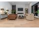 Cozy living room with fireplace, comfortable seating, and bright natural light at 661 Manchester Dr, Raleigh, NC 27609