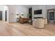 Modern living room with hardwood floors, fireplace, and contemporary furniture at 661 Manchester Dr, Raleigh, NC 27609