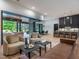 Open living area with access to the backyard, modern kitchen, and dining space at 661 Manchester Dr, Raleigh, NC 27609