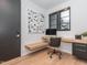 Modern home office with built-in desk, sleek cabinetry, and natural light at 661 Manchester Dr, Raleigh, NC 27609