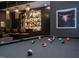 Game room featuring a pool table and bar area with unique lighting fixtures at 661 Manchester Dr, Raleigh, NC 27609