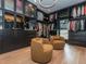 Spacious walk-in closet provides ample storage, soft seating, and a light fixture at 661 Manchester Dr, Raleigh, NC 27609