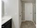 Bathroom featuring a modern sink, vanity, and shower with tiled floors at 664 Lavenham Ln, Fuquay Varina, NC 27526