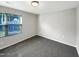Bedroom with grey carpet, a window and neutral colored walls at 664 Lavenham Ln, Fuquay Varina, NC 27526
