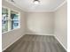 Bedroom with neutral colors, carpeted floors, and large windows at 664 Lavenham Ln, Fuquay Varina, NC 27526