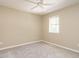 Clean bedroom with a window and ceiling fan at 7408 Sandy Creek Dr, Raleigh, NC 27615