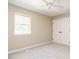 Clean bedroom with a window and closet at 7408 Sandy Creek Dr, Raleigh, NC 27615