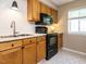 Well-equipped kitchen featuring stainless steel appliances and ample countertop space for meal preparation at 7408 Sandy Creek Dr, Raleigh, NC 27615
