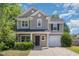 Charming two-story home boasts a manicured lawn, attached garage, and inviting front entrance at 776 Averasboro Dr, Clayton, NC 27520