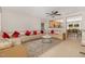 Spacious living room with plush L-shaped seating, ceiling fan and views into the kitchen and dining area at 776 Averasboro Dr, Clayton, NC 27520