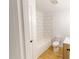 Bright bathroom featuring tiled shower, toilet, and wooden vanity with white sink and counter top at 9614 Quail Roost Rd, Bahama, NC 27503
