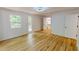 Bright bedroom featuring hardwood floors, natural light, closet, and white paint at 9614 Quail Roost Rd, Bahama, NC 27503