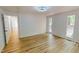 Bedroom boasting new wood floors, trim, windows, and paint at 9614 Quail Roost Rd, Bahama, NC 27503