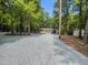 Beautiful home with a large gravel driveway and wooded surroundings at 9614 Quail Roost Rd, Bahama, NC 27503