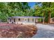 Charming ranch-style home with a well-manicured lawn and covered front entrance, perfect for outdoor living at 9614 Quail Roost Rd, Bahama, NC 27503