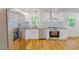 Modern kitchen featuring stainless steel appliances, white cabinets, and granite countertops at 9614 Quail Roost Rd, Bahama, NC 27503