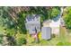 Aerial view of the property showcasing the house, deck, and surrounding landscape at 100 Mill Creek Dr, Fuquay Varina, NC 27526