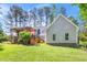 Lush backyard with a pergola-covered deck and well-maintained lawn at 100 Mill Creek Dr, Fuquay Varina, NC 27526