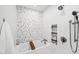 Spa-like bathroom with a soaking tub, shower niche, and white tile surround at 100 Mill Creek Dr, Fuquay Varina, NC 27526