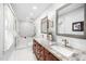 Elegant bathroom with double vanity, granite countertop, and a modern shower and tub at 100 Mill Creek Dr, Fuquay Varina, NC 27526