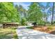 Charming home with a long driveway, well-kept lawn, and a barn at 100 Mill Creek Dr, Fuquay Varina, NC 27526