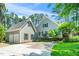 Charming home exterior with well-manicured lawn and detached two-car garage at 100 Mill Creek Dr, Fuquay Varina, NC 27526