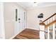 Inviting foyer with hardwood floors leads to the staircase and main living areas at 100 Mill Creek Dr, Fuquay Varina, NC 27526