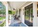 Cozy front porch with seating area, decorative rug, and stylish decor at 100 Mill Creek Dr, Fuquay Varina, NC 27526