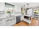 Modern kitchen featuring granite countertops, stainless steel appliances and white cabinetry at 100 Mill Creek Dr, Fuquay Varina, NC 27526