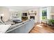 Spacious living room flows into the dining room, with a fireplace and comfortable seating at 100 Mill Creek Dr, Fuquay Varina, NC 27526