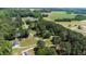 Panoramic aerial view of a wooded neighborhood with scattered residences at 103 Rex Pl, Louisburg, NC 27549