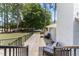 A wooden back deck offers an outdoor seating area, ideal for relaxation or entertaining guests at 103 Rex Pl, Louisburg, NC 27549