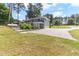 Backyard with upper deck, parking area, and some landscaping at 103 Rex Pl, Louisburg, NC 27549