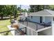 Multi-tiered backyard deck with black metal railings, providing ample space for outdoor enjoyment and relaxation at 103 Rex Pl, Louisburg, NC 27549