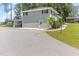 Side view of the house showing parking, a back door, and second story patio at 103 Rex Pl, Louisburg, NC 27549