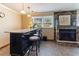 Bar area with bar seating, fireplace, and tile floors at 103 Rex Pl, Louisburg, NC 27549