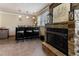 Bar area with fireplace, bar seating, and pendant lighting at 103 Rex Pl, Louisburg, NC 27549