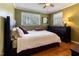 Bedroom with wood floors, natural light, and dark wood furniture at 103 Rex Pl, Louisburg, NC 27549