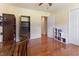 Bright bedroom featuring a desk and an open closet for organized storage and easy access at 103 Rex Pl, Louisburg, NC 27549