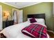 Bedroom with wood floors and view into hallway at 103 Rex Pl, Louisburg, NC 27549