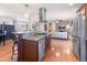 Open concept kitchen with granite countertops, stainless appliances and hardwood floors at 103 Rex Pl, Louisburg, NC 27549
