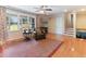 Bright living room with large windows, hardwood floors, and a cozy seating area, perfect for relaxation at 103 Rex Pl, Louisburg, NC 27549