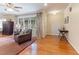 The living room features hardwood floors, large windows with curtains, and comfortable seating at 103 Rex Pl, Louisburg, NC 27549