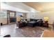 Basement Living room with tile floors, fireplace, and cozy couches at 103 Rex Pl, Louisburg, NC 27549